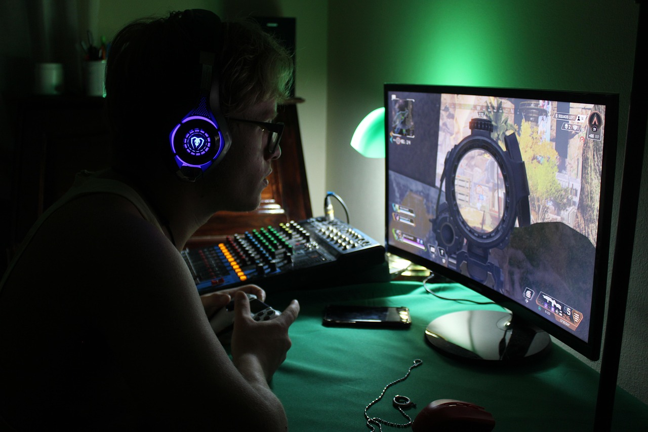  Image of a young man playing video games.